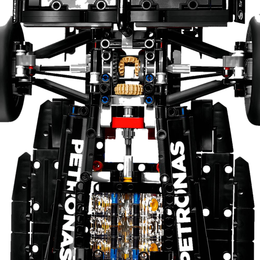 Detalhe interno do motor V6 com pistões móveis, diferencial e suspensão exposta da Mercedes W14